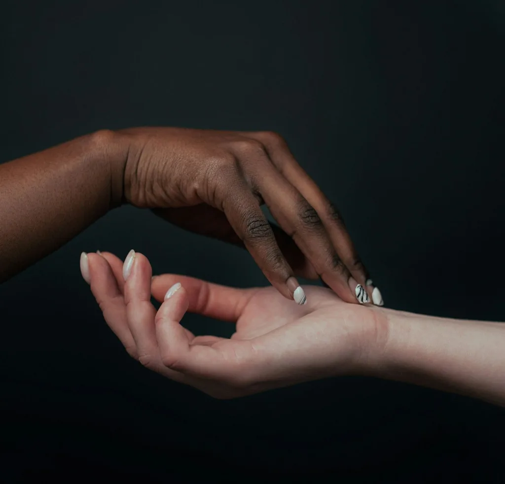 One pair of hands offering to another